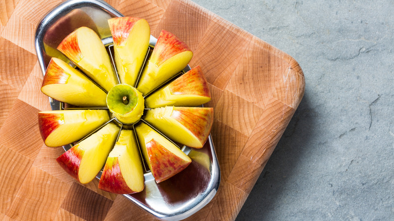 apple slicer slicing through an apple