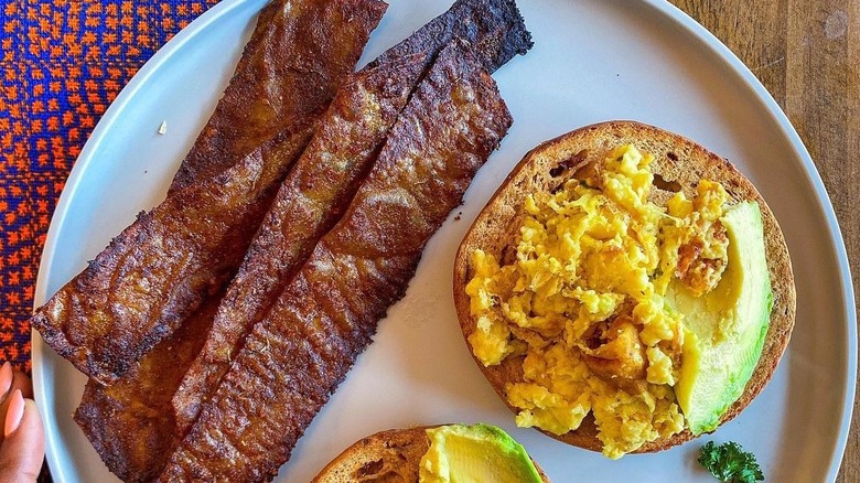 Vegan rice paper bacon and tofu "egg" breakfast sandwich