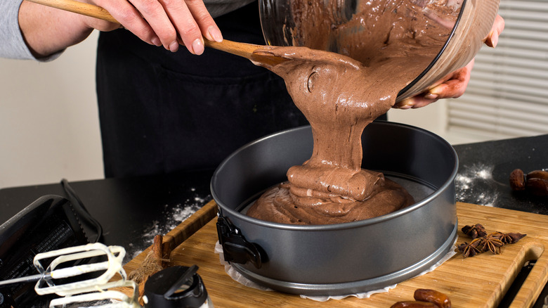 Pouring cake batter into pan