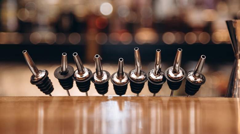 A range of liquor spouts lined up in a row