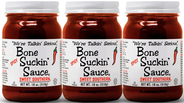 Three cans of Bone Suckin' Sauce