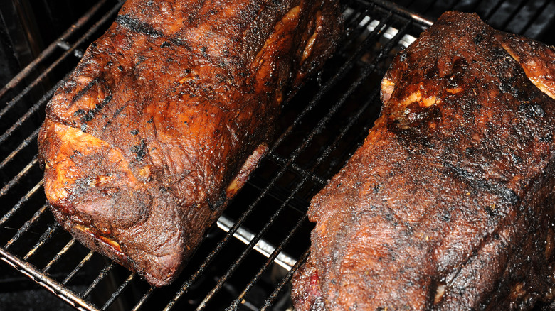 Pork butts on a grill