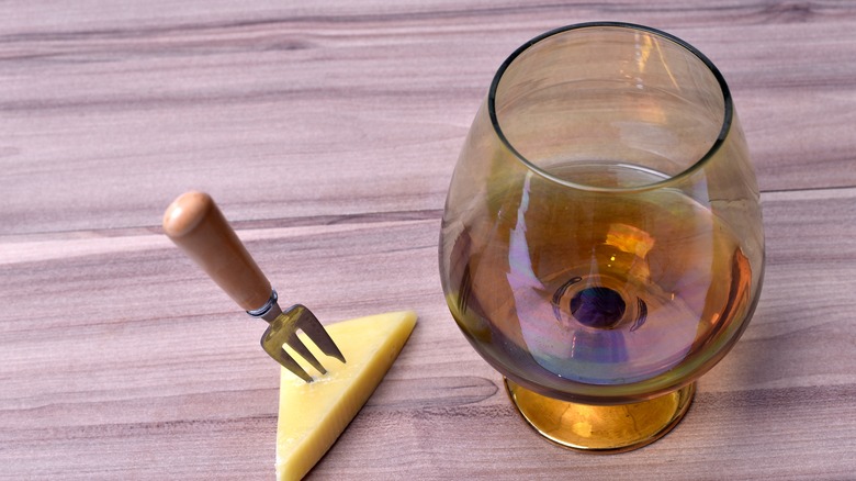 glass of Cognac with gruyere cheese