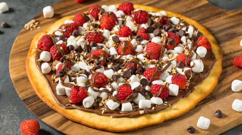 Dessert pizza with nutella and raspberries
