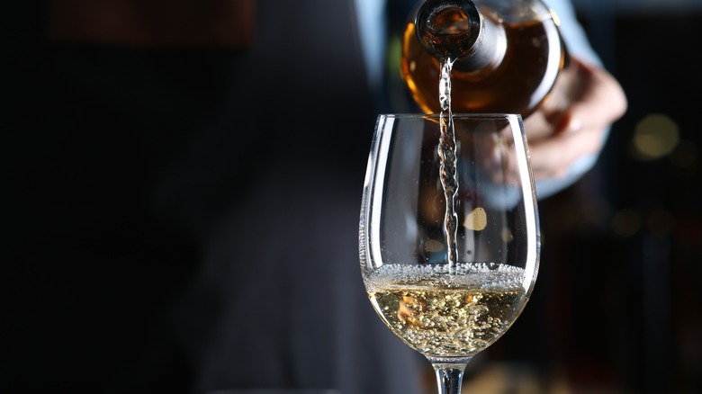 chardonnay poured into wine glass