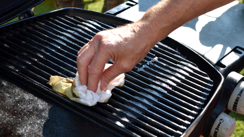 cleaning an outdoor grill with oiled cloth