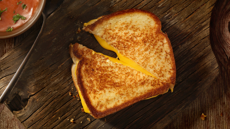 Grilled cheese sandwich on wooden board