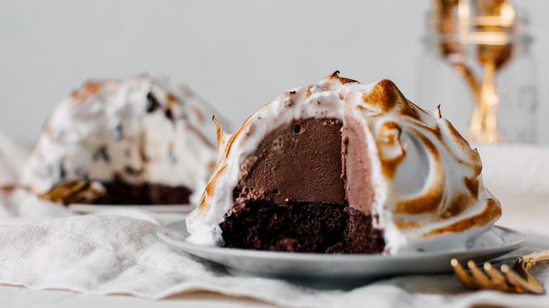 Baked Alaska on plate with slice removed