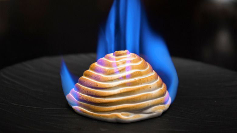 Flaming baked Alaska set alight