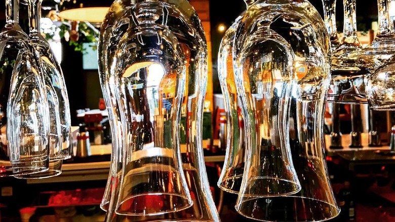 hanging glasses in bar gantry