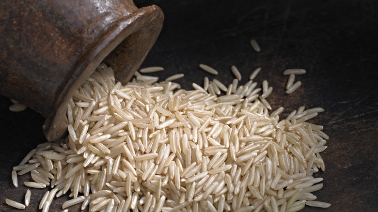 Uncooked basmati rice on table 