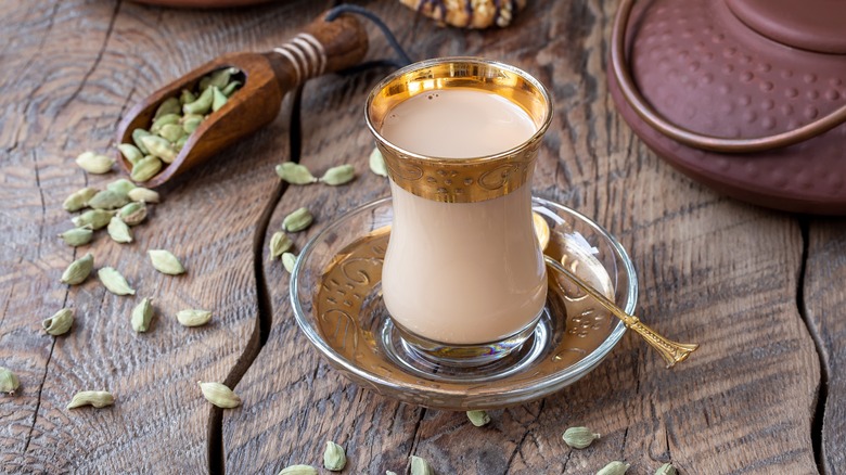 Cardamom chai with whole spices and pot