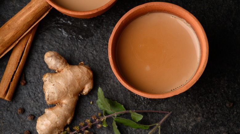 Masala chai with ginger root and cinnamon sticks 