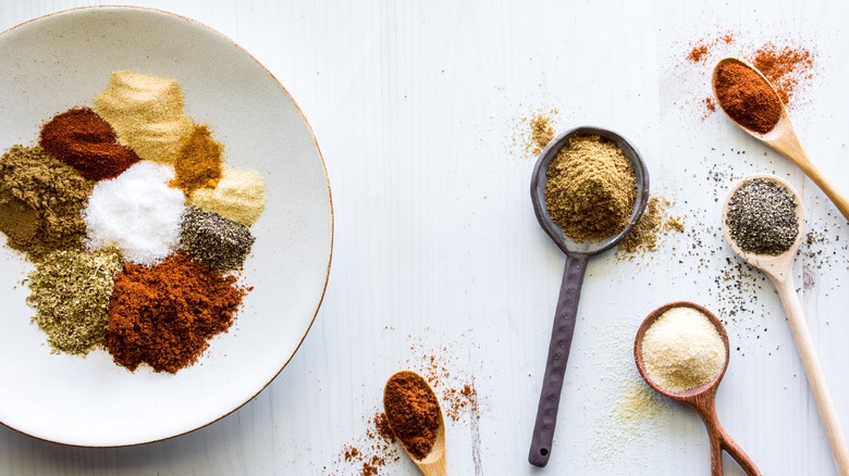 Spices in a plate and spoons