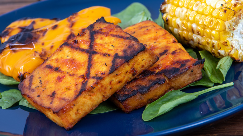 grilled tofu on plate with corn