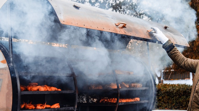 Smoke coming out of a meat smoker