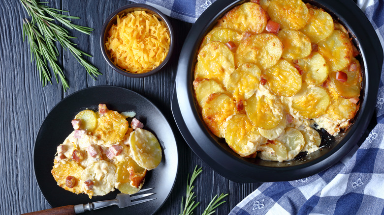 Scalloped potatoes with ham, cheddar, and rosemary