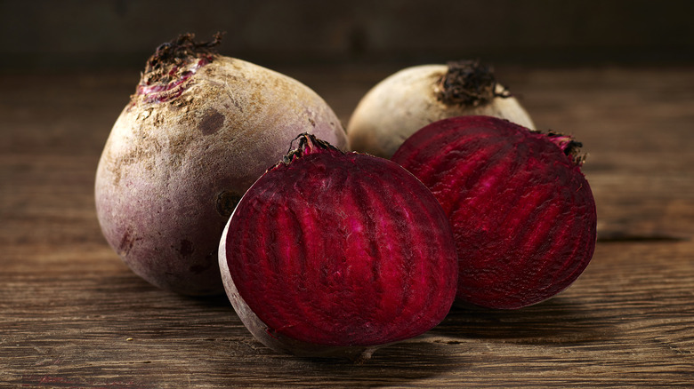 Halved and whole raw beets