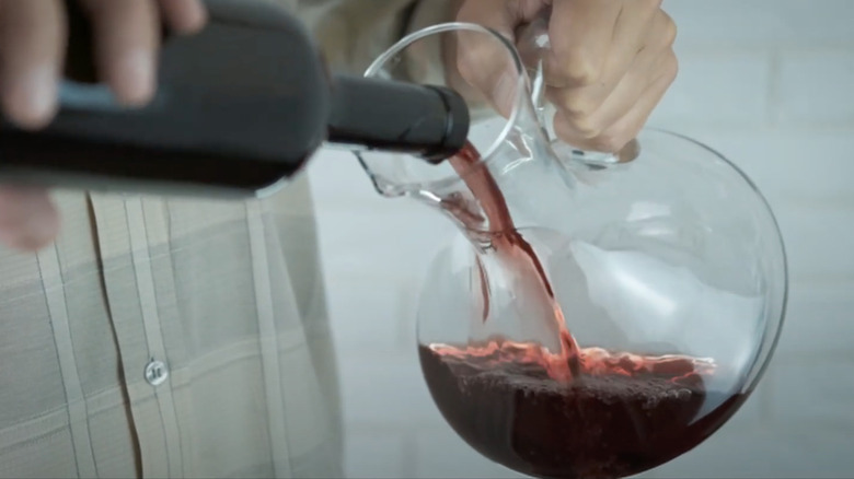 Decanting wine in a pitcher