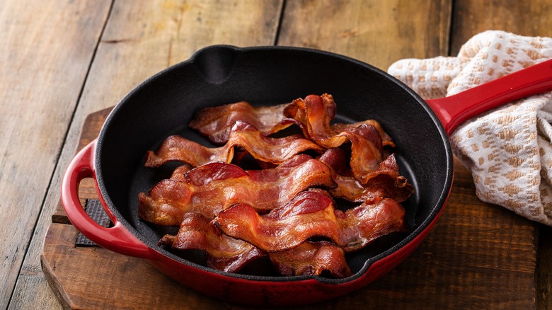 a pan of bacon on wood surface