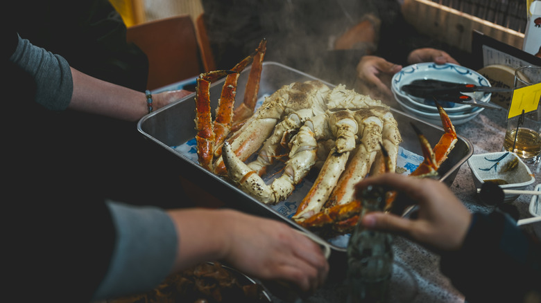 crab legs in a pan