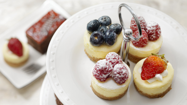 mini cheesecake desserts on tiered plate