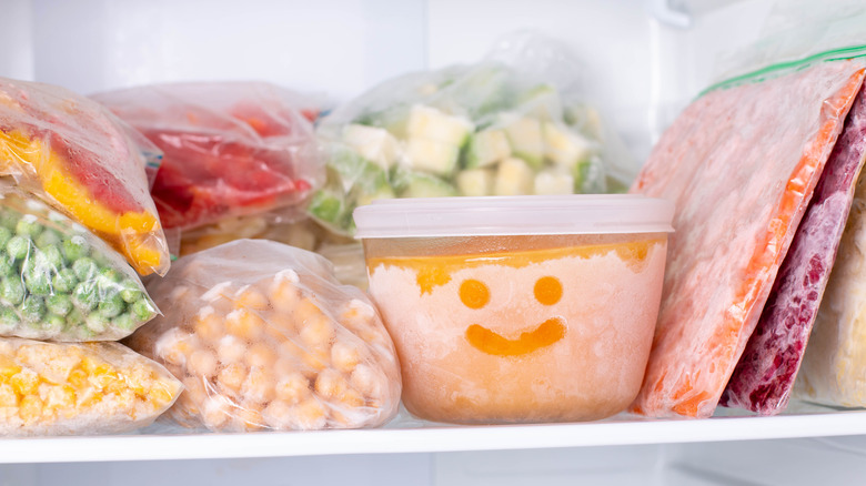 Bags and containers of food in a freezer