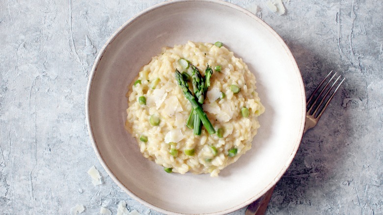 risotto topped with asparagus and parmesan