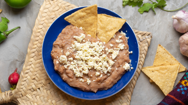 Refried beans topped with cheese
