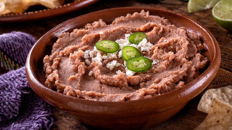 Refried beans topped with jalapenos