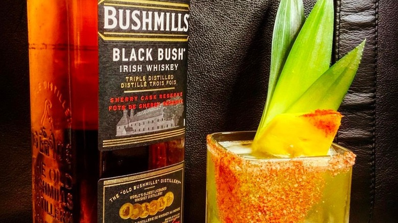 bushmills whiskey bottle and cocktail