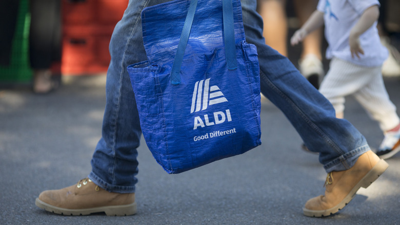 Man carrying Aldi bag