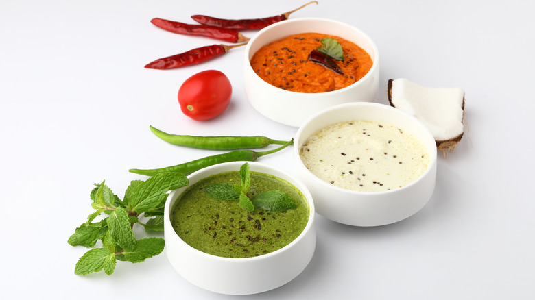 Bowls of chutney with chilies