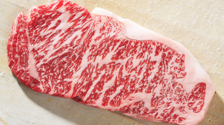 Heavily marbled raw Wagyu steak