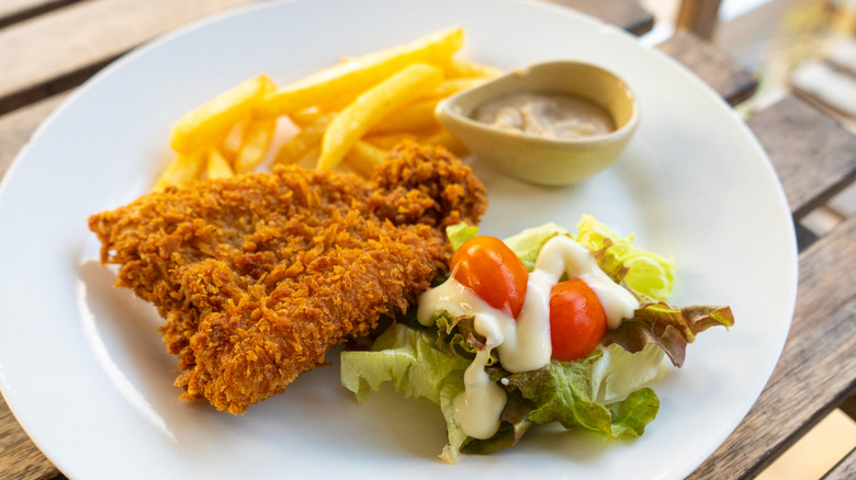 Plate with fried fish and french fries