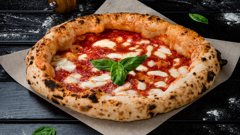 Homemade margherita pizza has a fluffy crust.