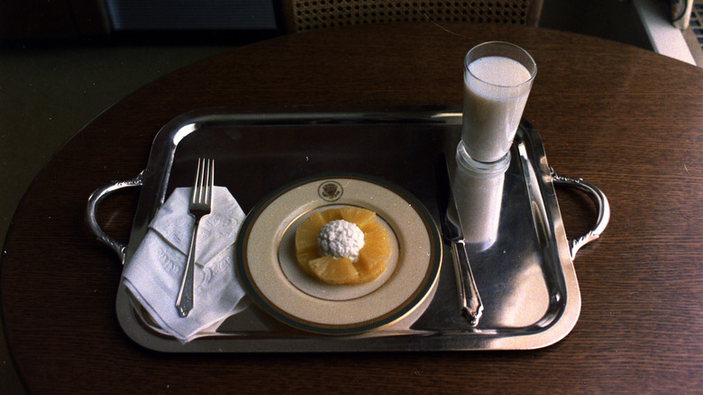 Richard Nixon's last meal in office, consisting of pineapple with cottage cheese and a glass of milk