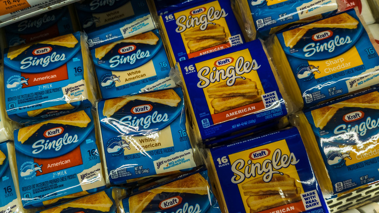 packages of Kraft cheese product in store