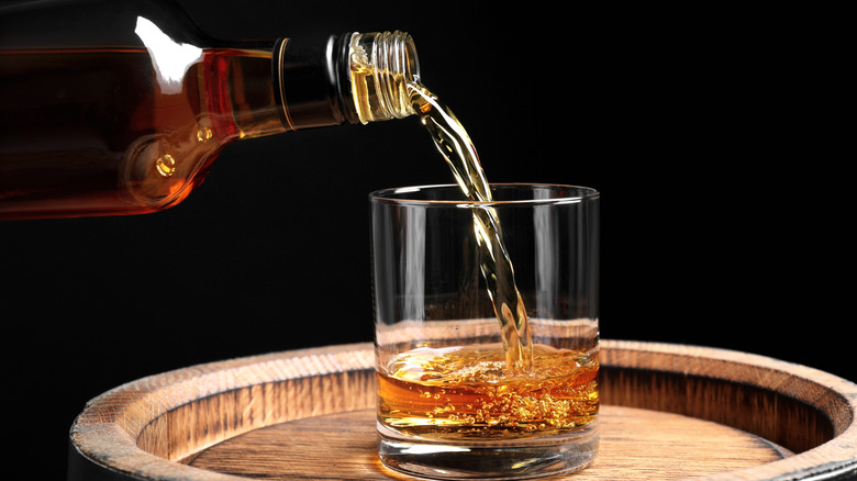 Pouring bourbon into glass