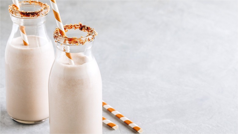 Milkshakes with cookie-rimmed glasses