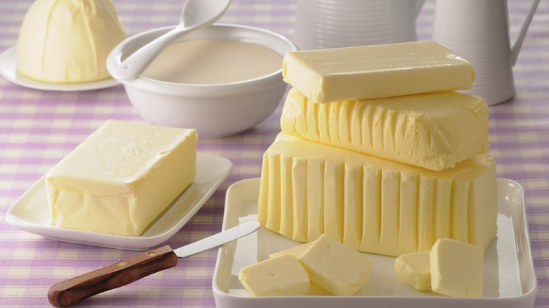 Blocks of butter with butter knife