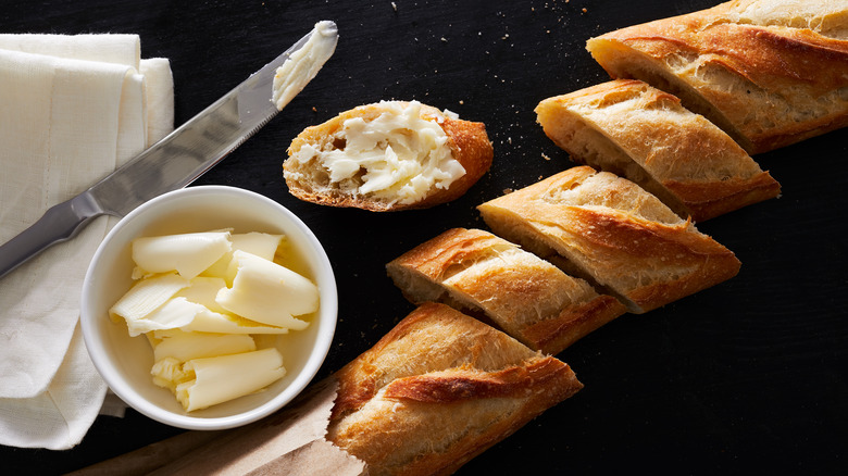 sliced French baguette and butter