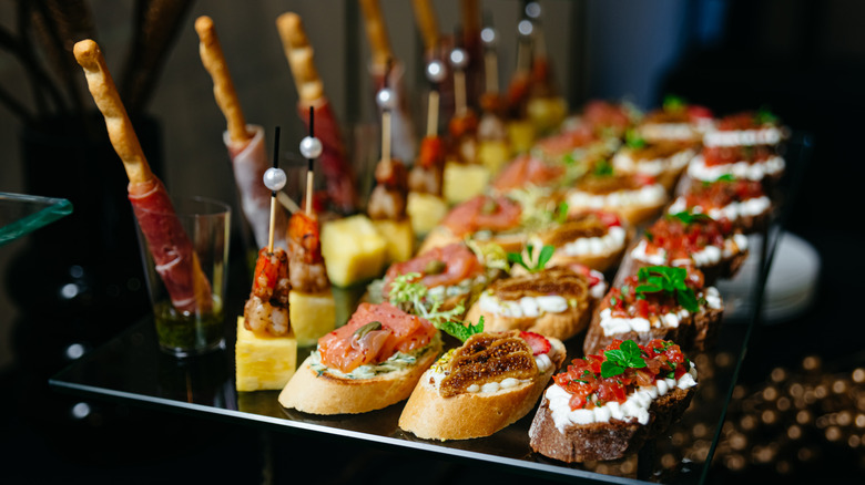 a plate full of small hors d'oeuvres