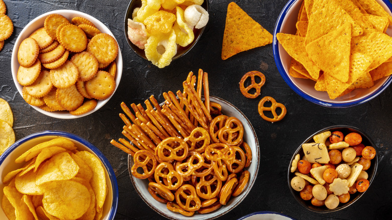 bowls of assorted salty snacks