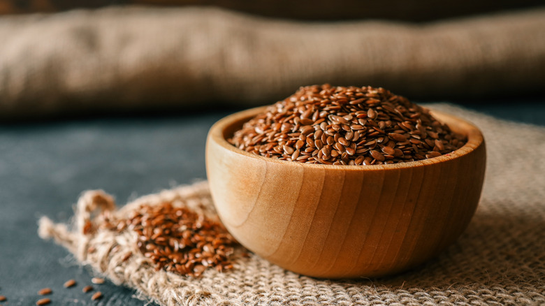 Flax seed in a small wooden bowl