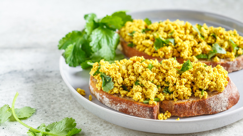 Vegan tofu scramble with cilantro on toast