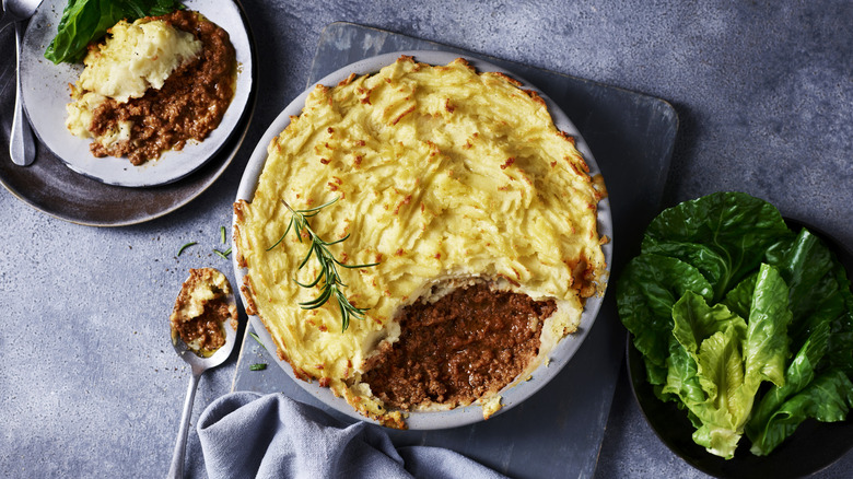 Shepherd's pie in a bowl with a scoop taken out of it