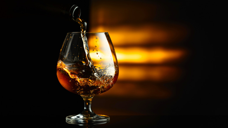 Cognac being poured into a snifter