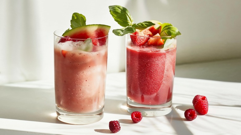 Watermelon and strawberry smoothies with herbs and fruit