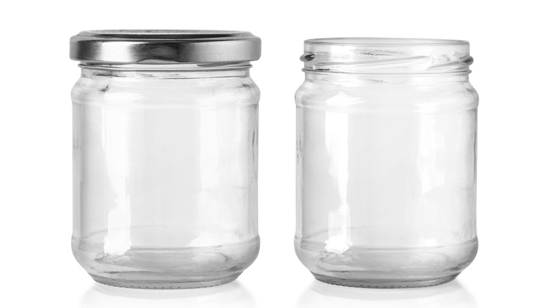 Two small canning jars against white background